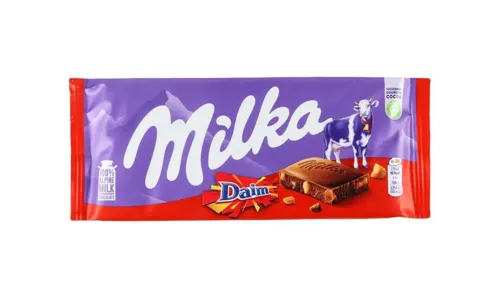 Шоколад молочний зі шматочками хрумкої карамелі з мигдалем Milka м/у 100г