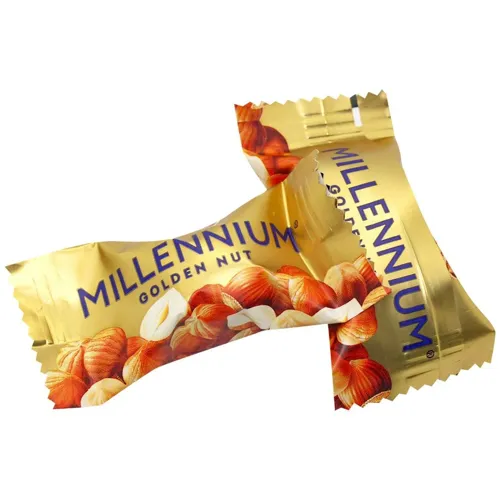 Цукерки Millennium Golden Nut з начинкою та цілими горіхами